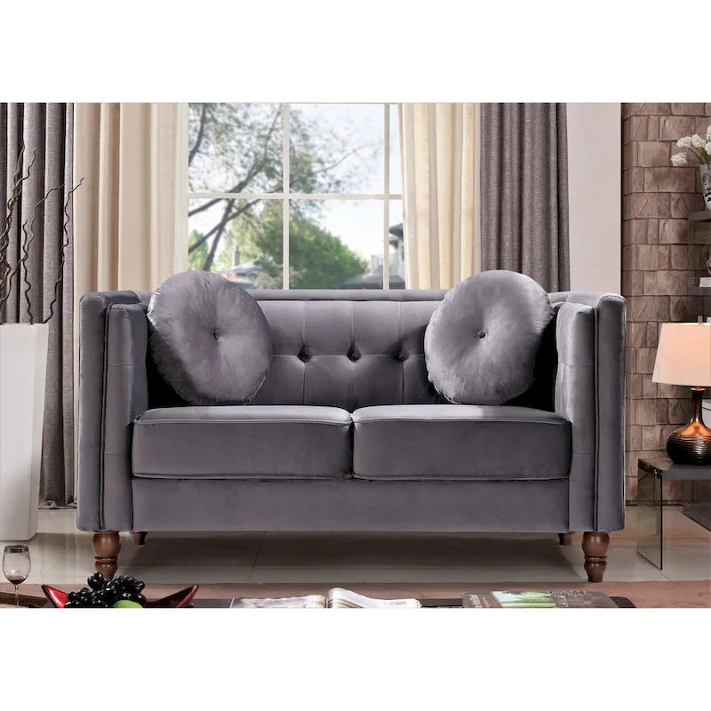 Polstersofa aus Samt mit Knopfheftung an Rückenlehne und Kissenrollen
