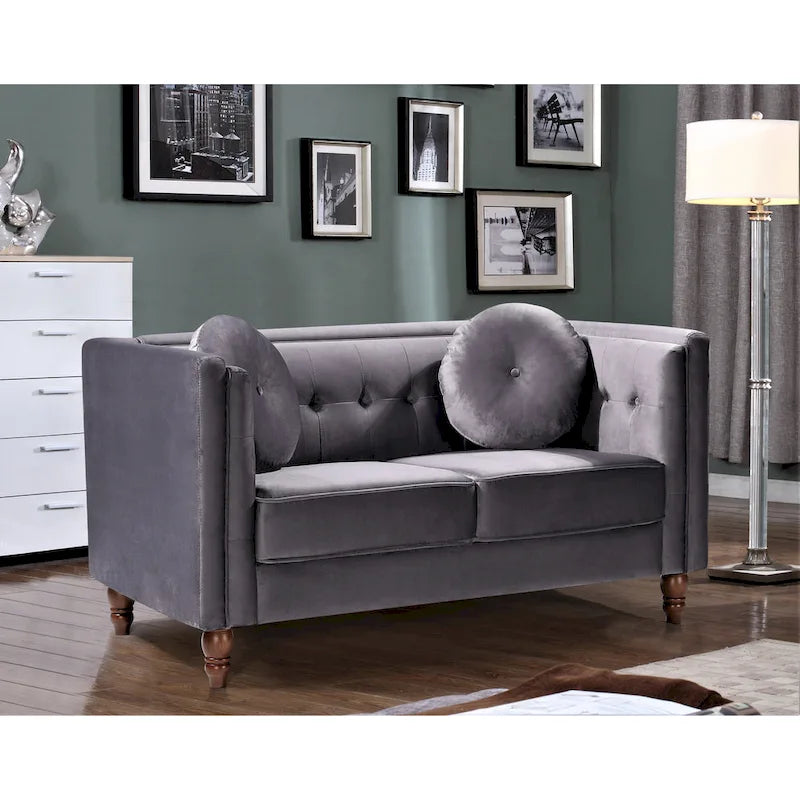 Polstersofa aus Samt mit Knopfheftung an Rückenlehne und Kissenrollen