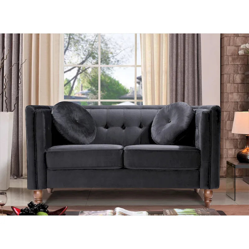 Polstersofa aus Samt mit Knopfheftung an Rückenlehne und Kissenrollen
