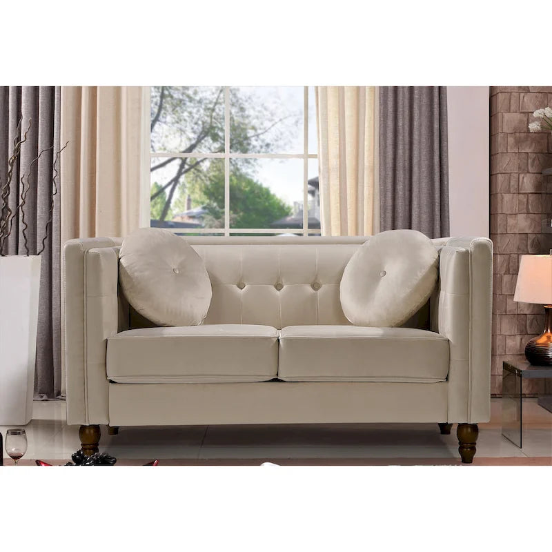 Polstersofa aus Samt mit Knopfheftung an Rückenlehne und Kissenrollen