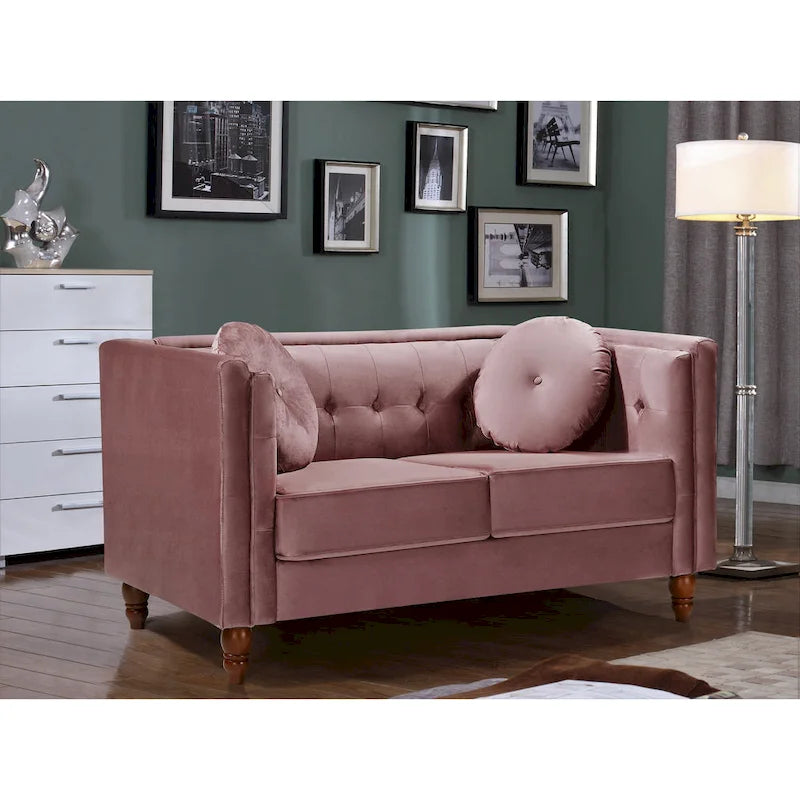 Polstersofa aus Samt mit Knopfheftung an Rückenlehne und Kissenrollen